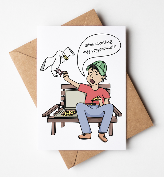 A white greeting card with a cartoon illustration of a man sitting on a bench holding a pepperoni slice, with a speech bubble reading 'Stop stealing my pepperoni!!!' and a white bird flying near him. The card is displayed on top of a brown kraft envelope against a clean white background.