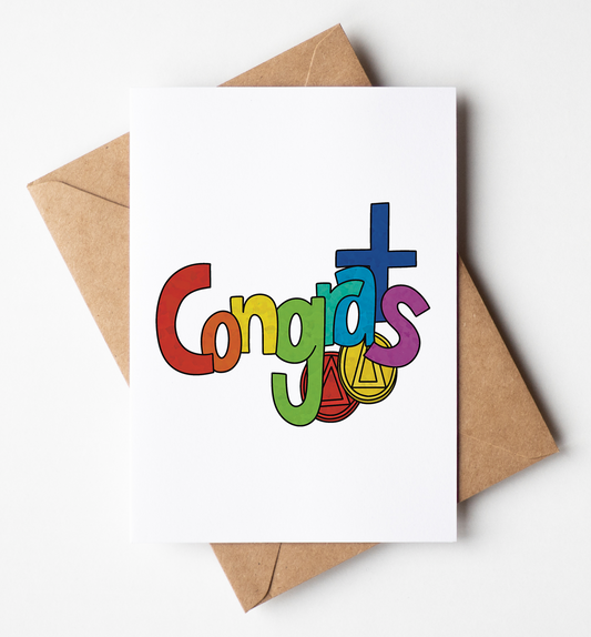A white greeting card with the word 'Congrats' spelled in colorful playful letters, placed on top of a brown kraft envelope against a clean white background.