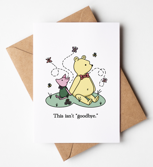 A white greeting card with a cartoon illustration of Winnie the Pooh and Piglet sitting together, with the text 'This isn't goodbye.' printed below.
